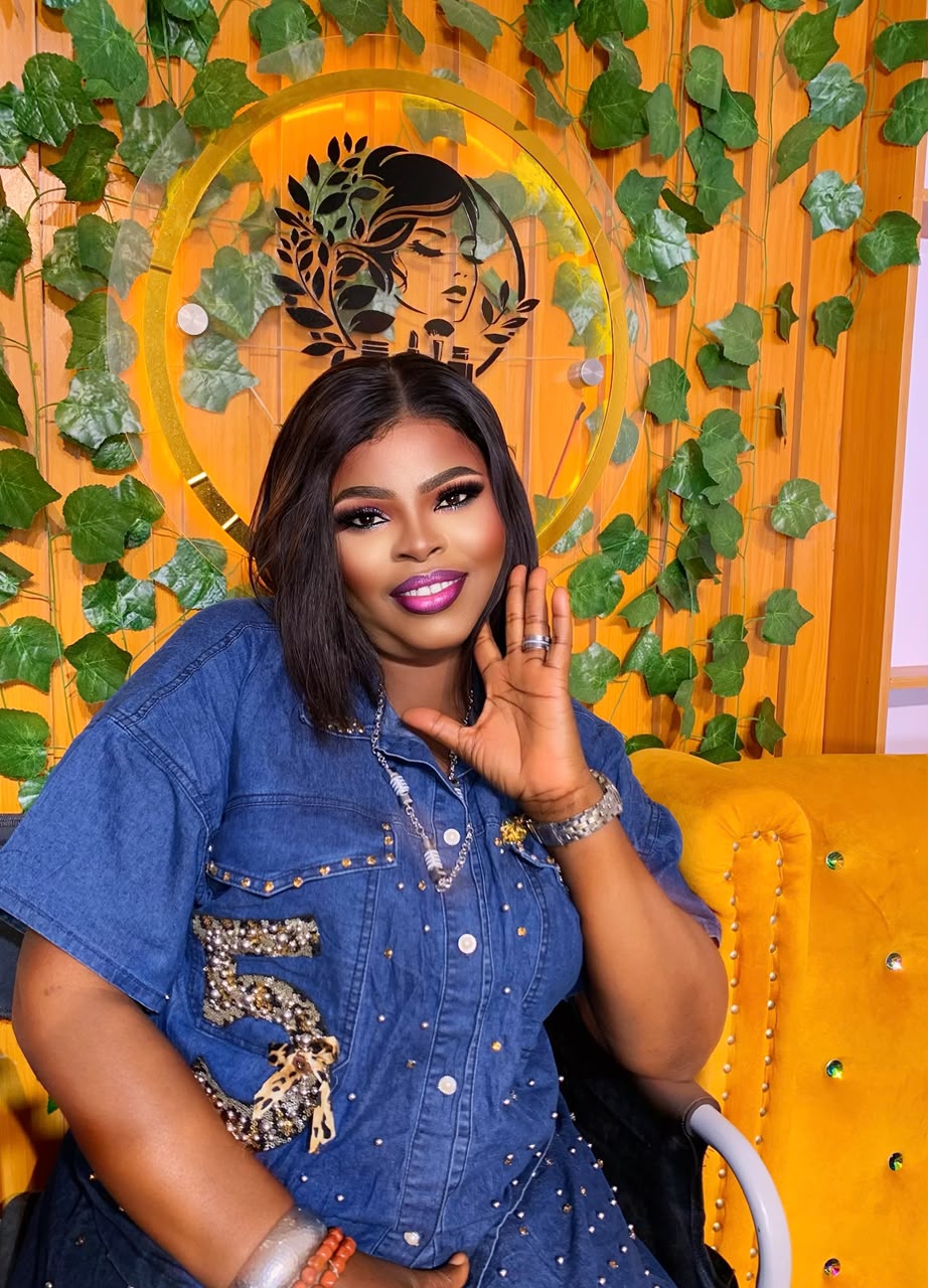 Full glam with denim in front of the studio greenery