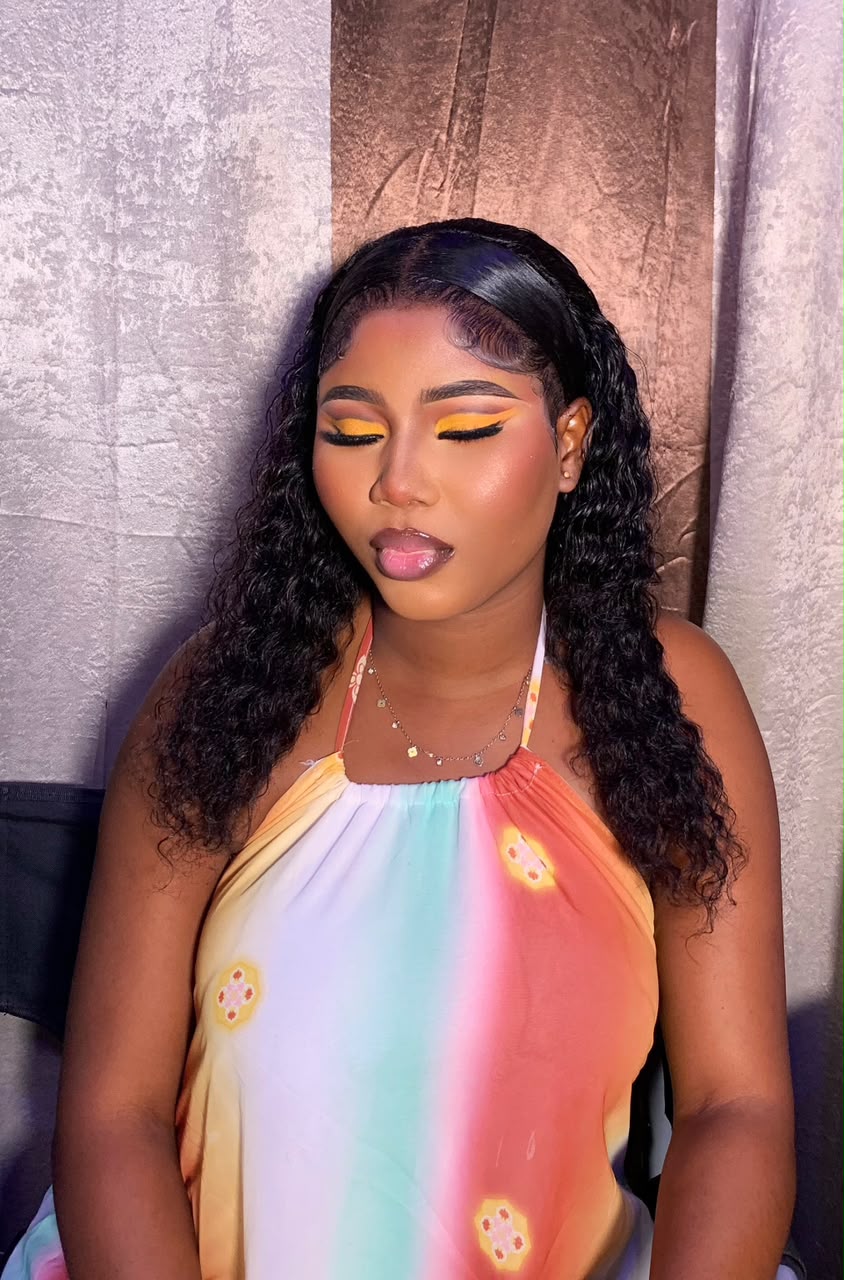 Yellow eye glam with a rainbow halter top