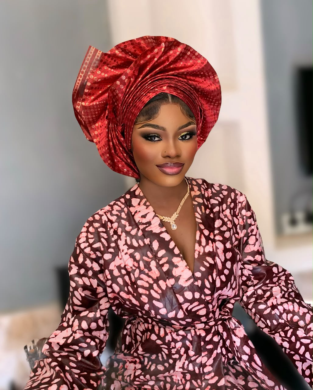 Red gele with patterned dress